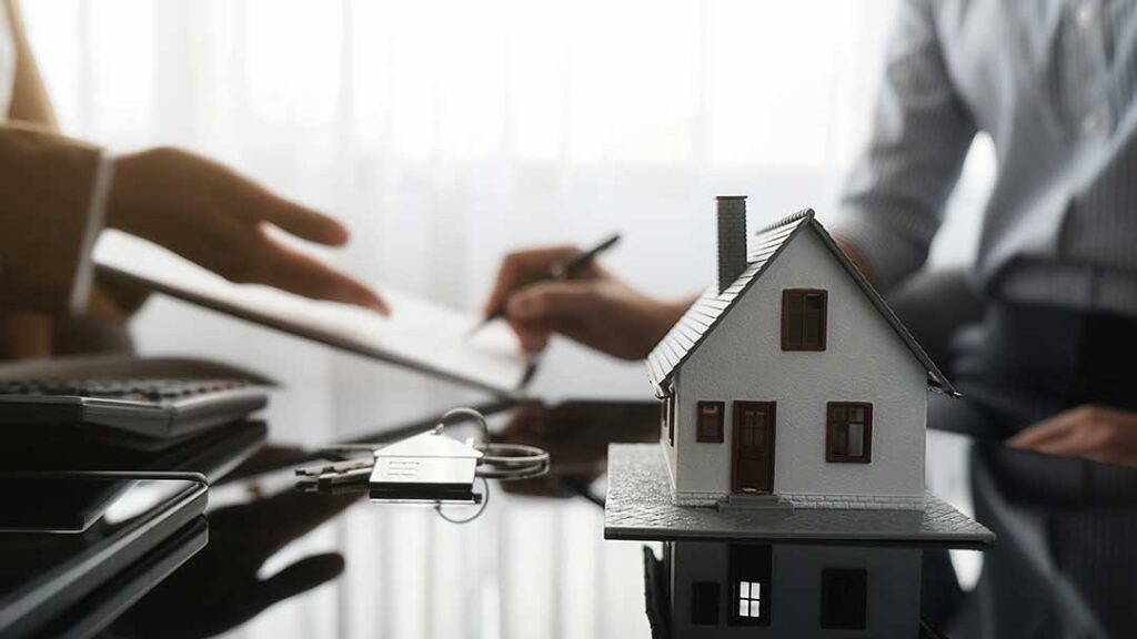 Homeowner reviewing insurance documents and comparing coverage details at a kitchen table